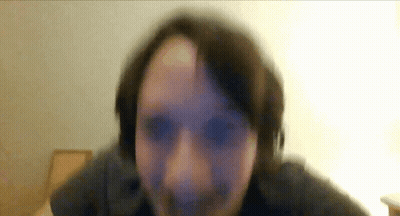 A Blurry Picture Of A Person 'S Face With A White Background GIF