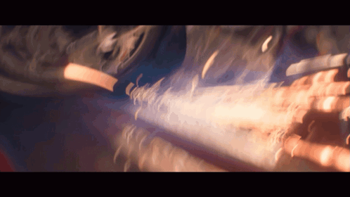 A Blurry Picture Of A Person 'S Hands With A Blue Light Coming Out Of Them GIF