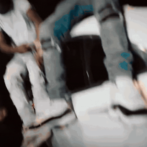 A Blurry Picture Of A Person 'S Legs And Feet With A Blue Circle In The Middle GIF