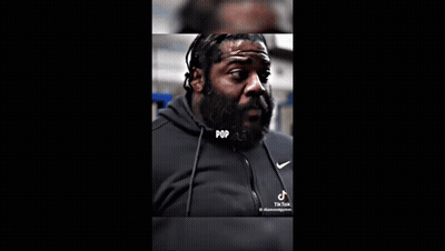 A Blurry Picture Of A Person Sitting At A Table With The Words `` El Wire '' On It . GIF