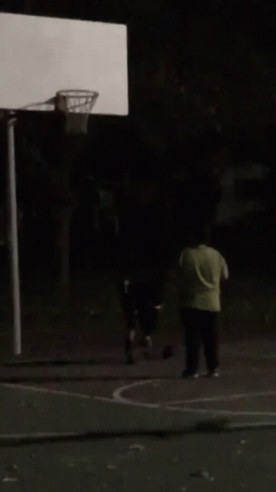 A Blurry Picture Of A Person Sitting In A Dark Room . GIF