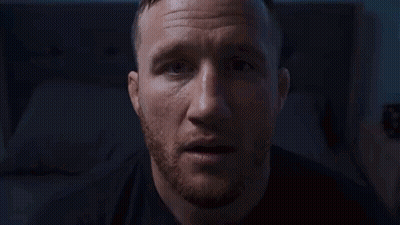 A Blurry Picture Of A Person Standing In A Dark Room In Front Of A Window . GIF