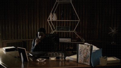 A Blurry Picture Of A Person Standing In A Dark Room . GIF
