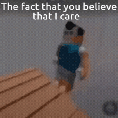 A Blurry Picture Of A Person Standing Next To A Wooden Table With The Words `` The Fact That You Believe That I Care '' GIF