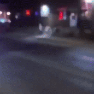 Blurry Person Walking Down Street GIF