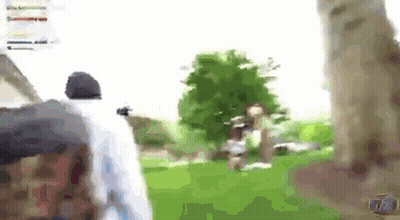 A Blurry Picture Of A Person Walking In A Park . GIF
