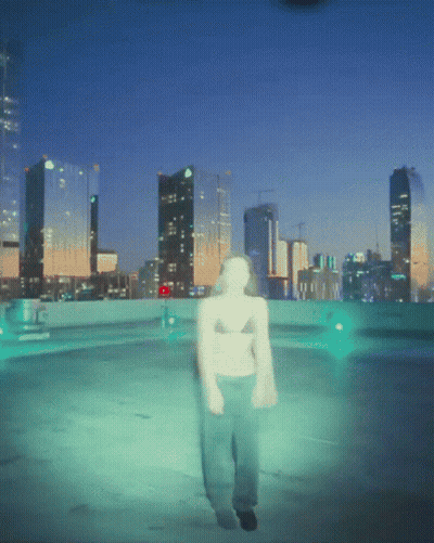 A Blurry Picture Of A Person Walking In Front Of A City Skyline At Night GIF