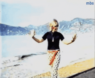 A Blurry Picture Of A Person Walking On A Beach With Mbs Written In The Corner GIF