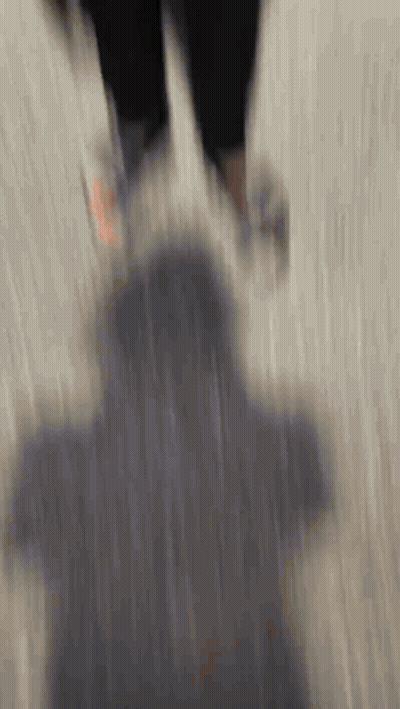 A Blurry Picture Of A Person Walking On A Carpet GIF