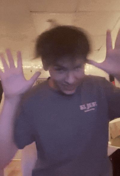 A Blurry Picture Of A Person Wearing A Shirt That Says Rvr On It GIF