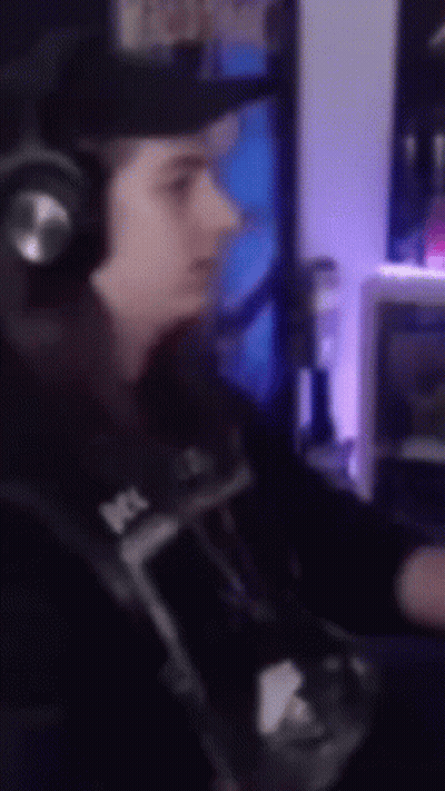 A Blurry Picture Of A Person Wearing Headphones And A Hat GIF