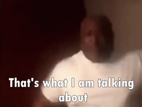 A Blurry Picture Of A Person With The Words `` That 'S What I Am Talking About '' Written In White Letters . GIF