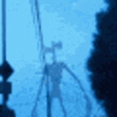 A Blurry Picture Of A Siren Head With A Microphone On A Blue Background . GIF