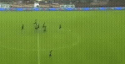A Blurry Picture Of A Soccer Field With A Goal And A Stadium In The Background GIF