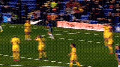 A Blurry Picture Of A Soccer Field With A Nike Banner In The Background GIF