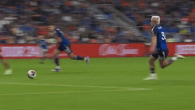 A Blurry Picture Of A Soccer Field With A Sign That Says ' Allianz ' GIF