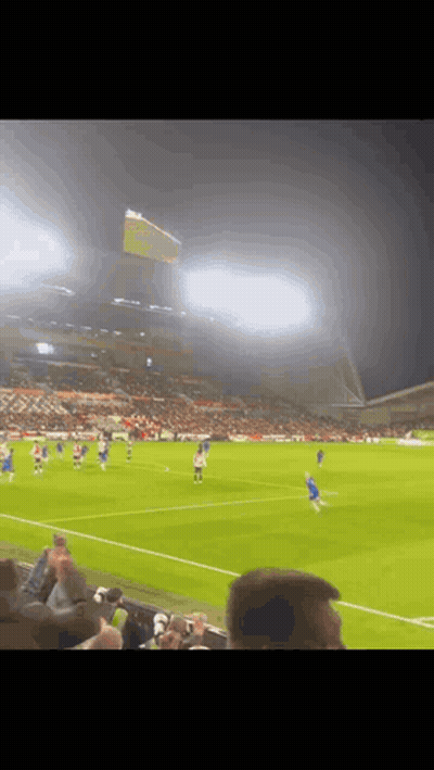 A Blurry Picture Of A Soccer Game Being Played GIF