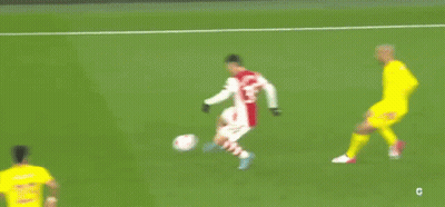 A Blurry Picture Of A Soccer Game With A Player Wearing A Number 14 Jersey GIF