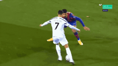 A Blurry Picture Of A Soccer Game With A Player Wearing A White Jersey With The Number 7 On It GIF
