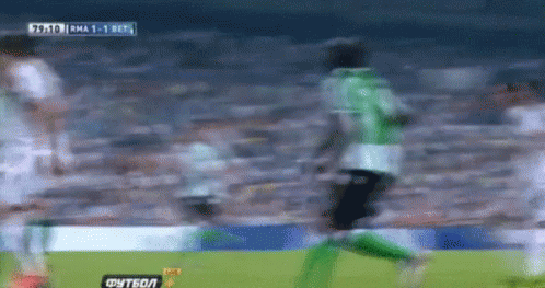 A Blurry Picture Of A Soccer Game With A Score Of 1-0 In The Background GIF