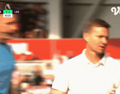 A Blurry Picture Of A Soccer Game With The Score 3-1 Lee GIF