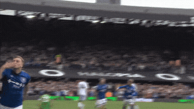 A Blurry Picture Of A Soccer Game With The Word Halopa On The Banner In The Background GIF