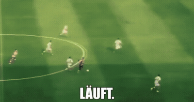 A Blurry Picture Of A Soccer Game With The Word Lauft In White GIF