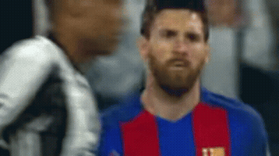 A Blurry Picture Of A Soccer Player Wearing A Blue And Red Jersey GIF