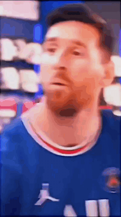 A Blurry Picture Of A Soccer Player Wearing A Blue Shirt . GIF