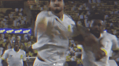 A Blurry Picture Of A Soccer Player With The Hashtag 77Ri2 On The Bottom Right GIF