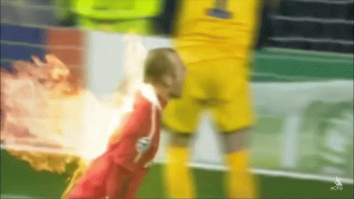 A Blurry Picture Of A Soccer Player With The Number 1 On The Back Of His Jersey GIF