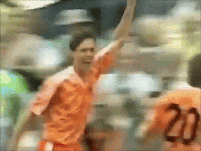 A Blurry Picture Of A Soccer Player With The Number 20 On His Back GIF