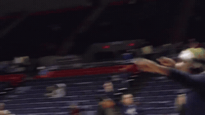 A Blurry Picture Of A Stadium With A Sign That Says ' A & E ' On It GIF