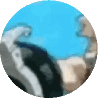 A Blurry Picture Of A Statue In A Circle With A Blue Background Sticker
