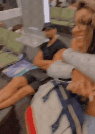 A Blurry Picture Of A Woman Holding A Man 'S Head GIF