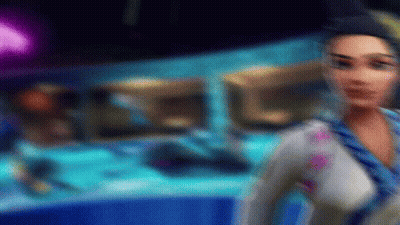 A Blurry Picture Of A Woman In A Blue And White Outfit GIF