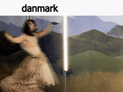 A Blurry Picture Of A Woman In A White Dress With The Word Danmark Above Her GIF