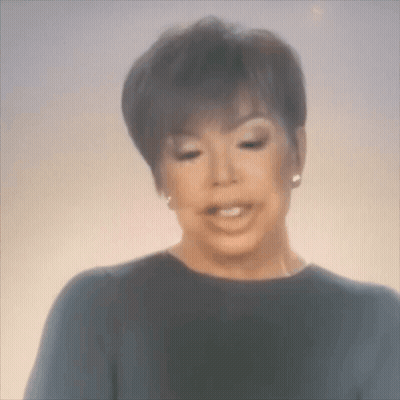 A Blurry Picture Of A Woman Making A Face . GIF