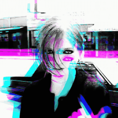 A Blurry Picture Of A Woman 'S Face With A Purple Background GIF