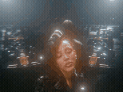 A Blurry Picture Of A Woman With Her Eyes Closed In A Dark Room GIF