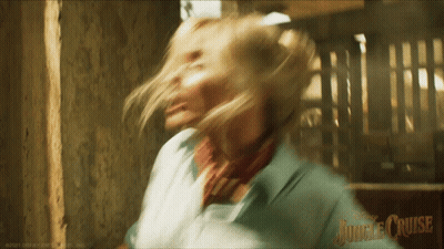 A Blurry Picture Of A Woman With Jungle Cruise Written On The Bottom Right GIF