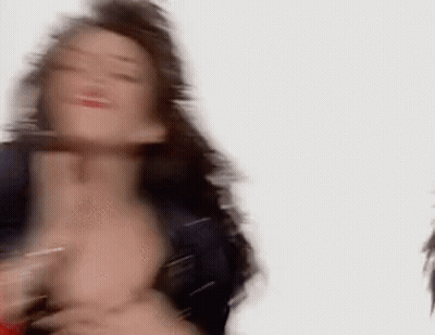 A Blurry Picture Of A Woman With Long Hair Dancing . GIF