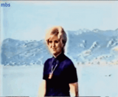 A Blurry Picture Of A Woman With Mbs Written On The Bottom Left GIF