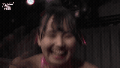 A Blurry Picture Of A Woman With The Hashtag #Tjpw On The Bottom Right GIF