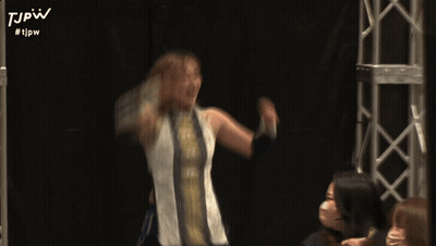 A Blurry Picture Of A Woman With #Tjpw On The Bottom Right GIF