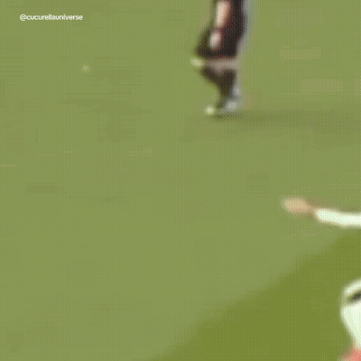 A Blurry Picture Of Soccer Players With One Wearing The Number 5 GIF