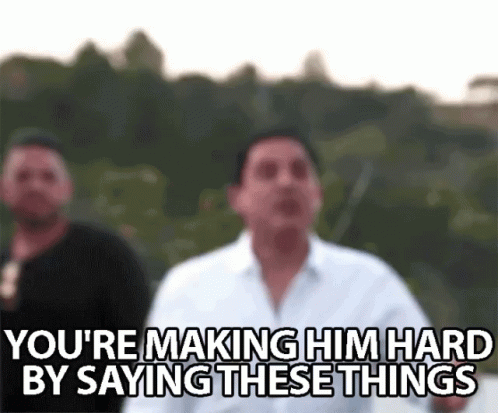 A Blurry Picture Of Two Men Standing Next To Each Other With The Caption `` You 'Re Making Him Hard By Saying These Thin GIF