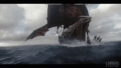 A Boat With A Dragon On It Is Floating In The Ocean GIF