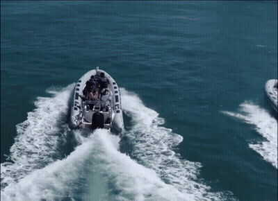 A Boat With A Mercury Motor Is Floating On The Water GIF