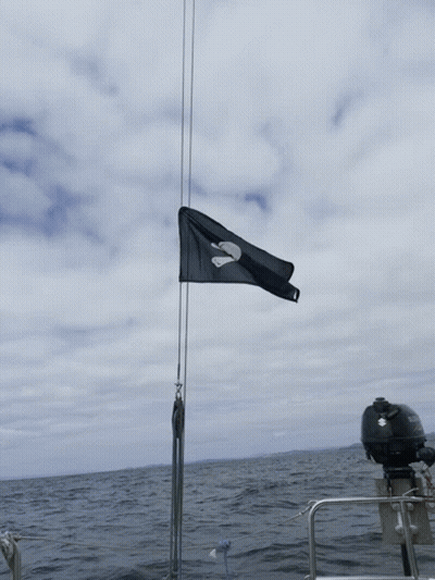 A Boat With A Suzuki Outboard Motor Is In The Ocean GIF